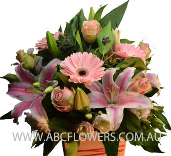 A014 Dockland a beautiful centre piece arrangement with pink lilies pink roses pink gerbeara and pink lisianthus